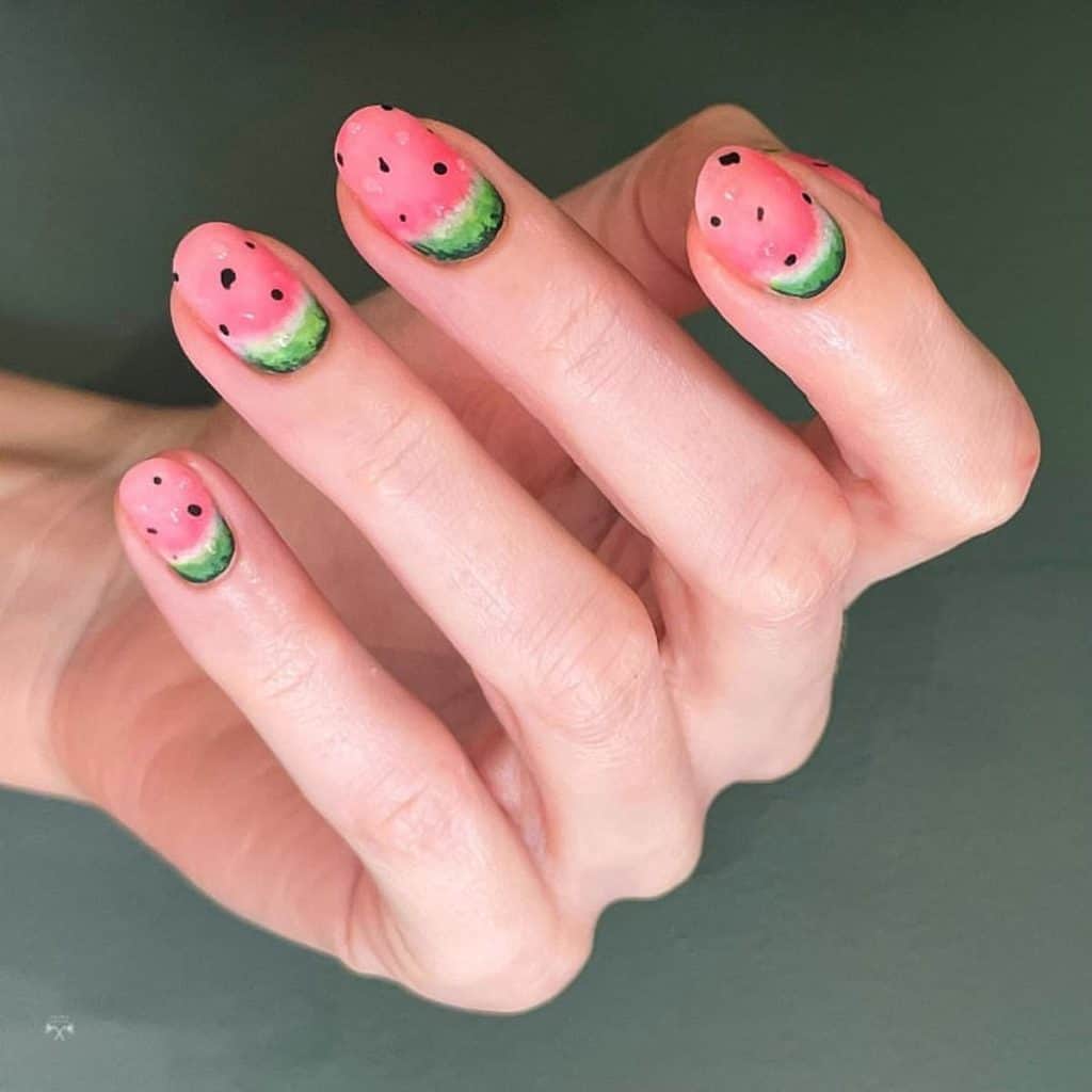 A woman's matte pink nails that mimic the juicy charm of watermelon slices