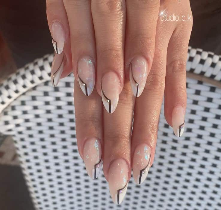 Crowned with pristine white half-French tips accented by a deep brown line artfully curving to one side, this design speaks volumes in hushed tones of sophistication.