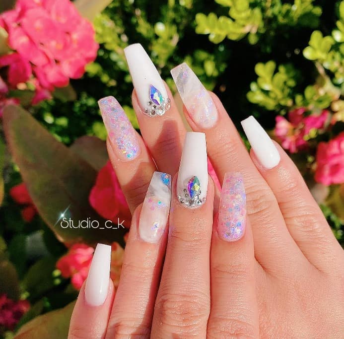 a clean and classic look, a touch of luxury with jewel drops, a subtle hint of design with white streaks on transparent nails, or a dash of magic with unicorn glitter on clear nails, this nail style has it all!
