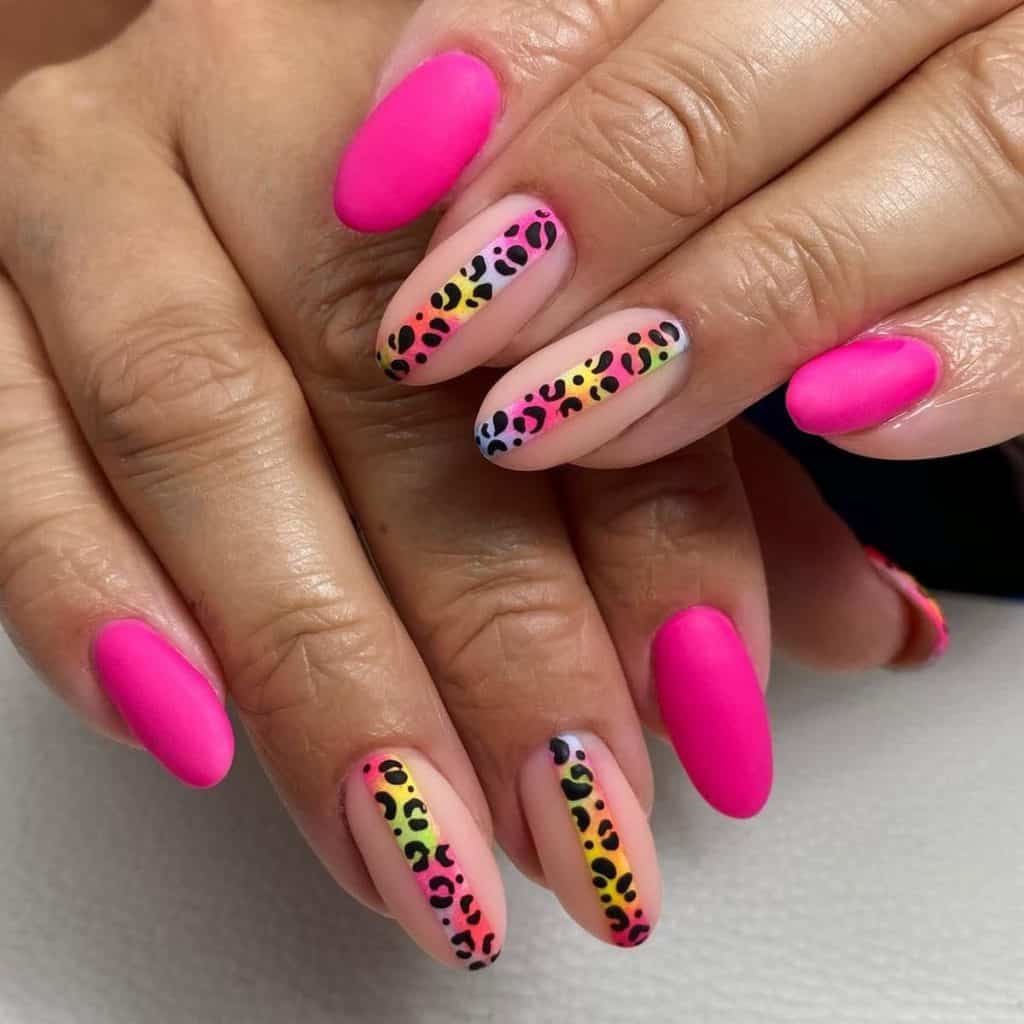 A woman's nude nails with Two nails here sport a nude base that features a multicolored line adorned with cheetah prints in the center.