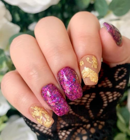 Go for these nails that are fully coated in chunky pink and purple glitter, juxtaposed against a nude base adorned with delicate gold foil.