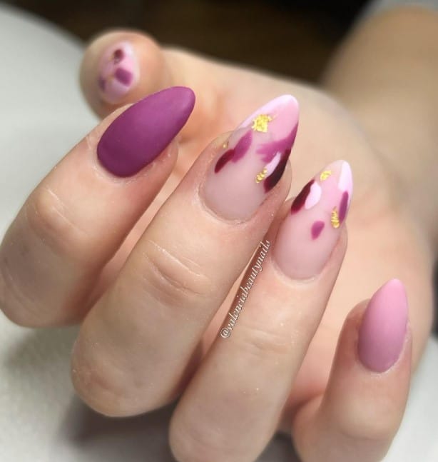 Celebrate your love of matte by getting this mani, in which lovely purple and blushing pink nails are offset by nude nails adorned with elegant splotches of pink, purple, red, and gold foil.