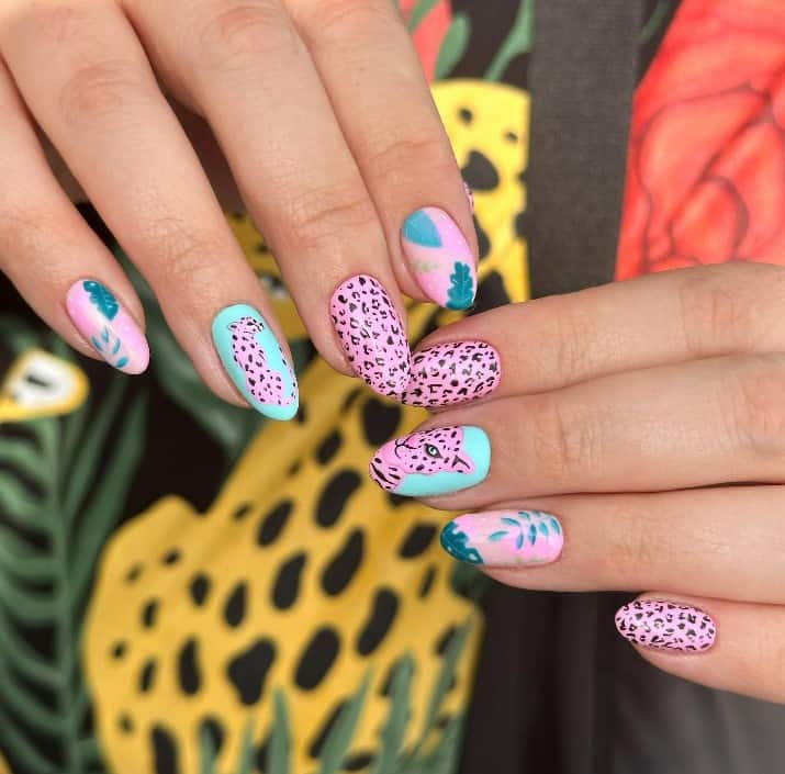 pink and black leopard nail art design accented by cool mint touches — a summer leopard nail fantasy that combines island vibes with feline finesse.